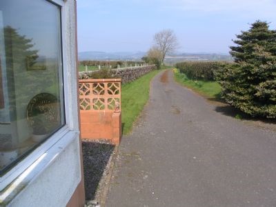 North past the porch down the drive.
