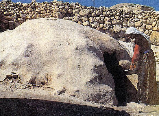 baking bread in a taboon