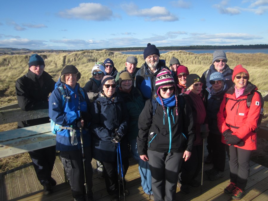 Walkers with the dunes.JPG