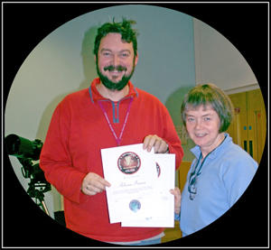 Rhona Fraser receives her certificates from interim Chairman, Maarten de Vries