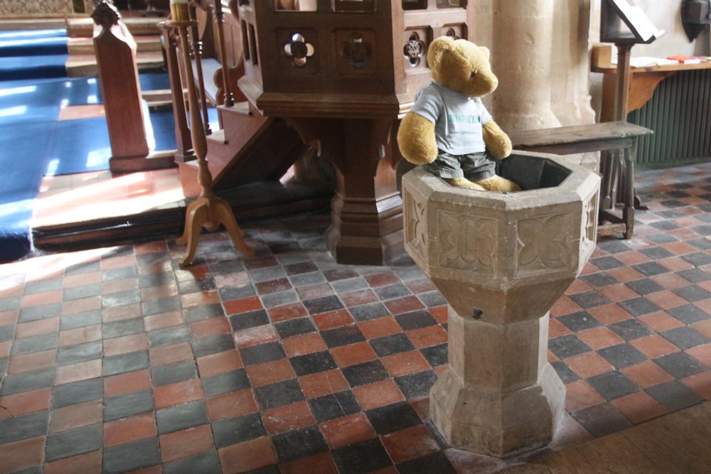 Big Ted sitting on another font