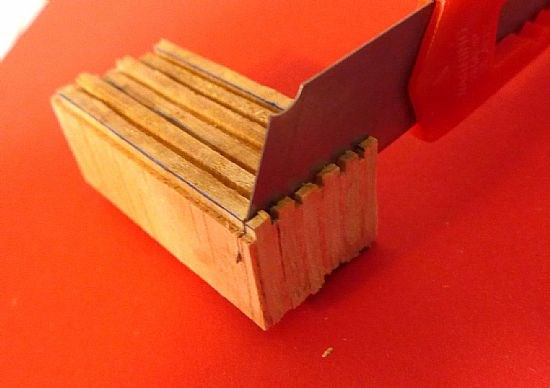 The characteristic castle wall top, crenels & merlons, were created by a number of thin balsa wood.