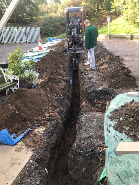 Installing the new water pipe.