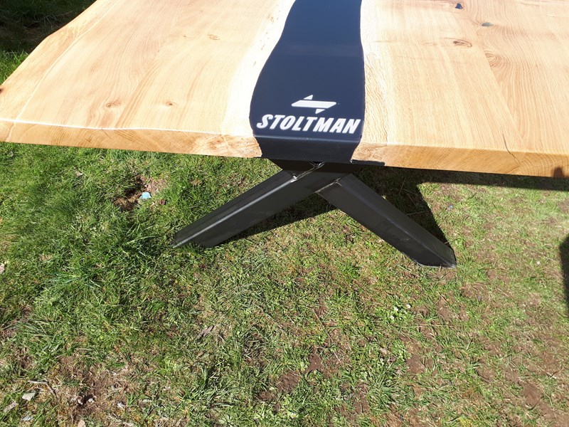 Stoltman table with their logo