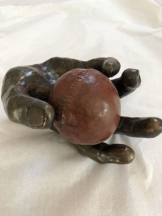 Hand with Cricket Ball