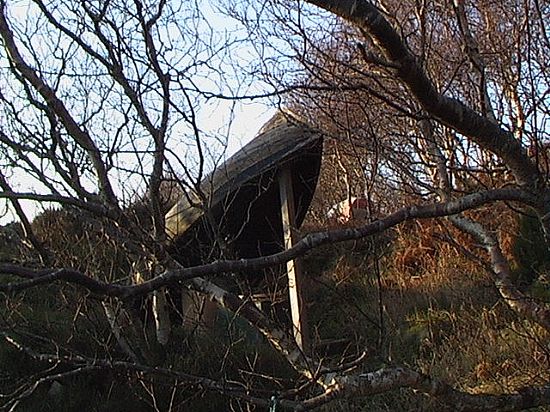 Toilet under an upturned boat