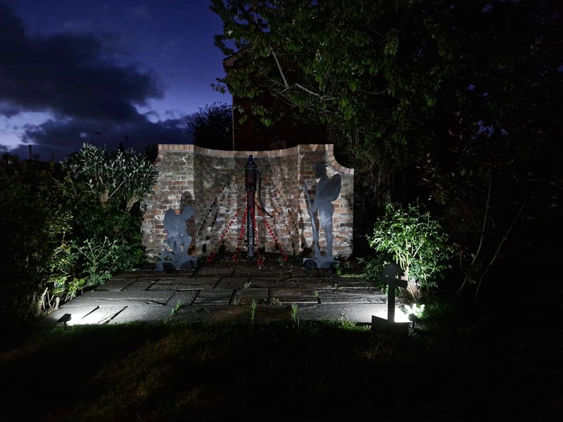 Millennium Garden at night with spotlights on decorations