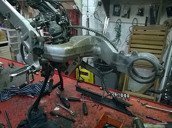 Close attention to the swinging arm and rear wheel bearing assembly