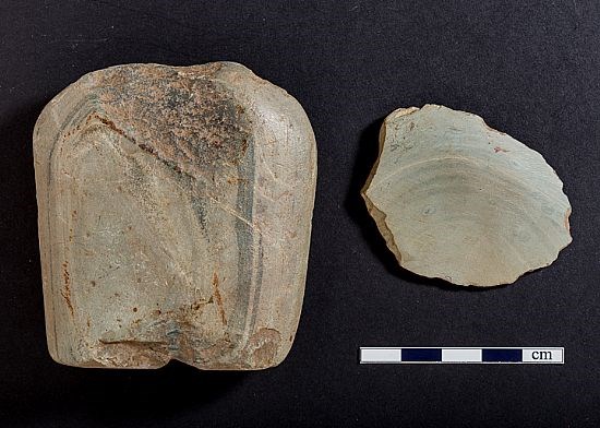 Part of a Neolithic stone axe and flake from a separate axe, both probably from Creag na Caillich ne