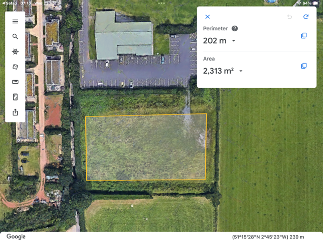 overhead photograph of the overflow carpark edged with hedging. The perimeter is 202m, The area is 2313 square meters.