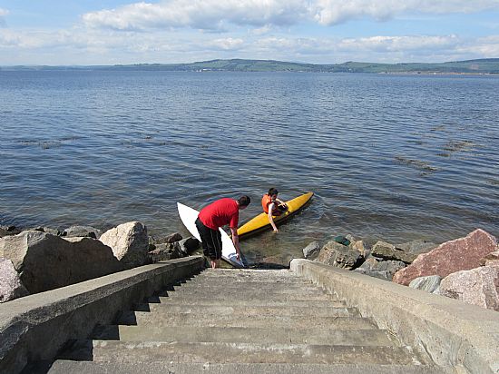 launching canoes from the steps opposite the Cottage