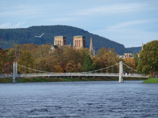 Inverness Cathedral from Ness Islands with suspension bridge