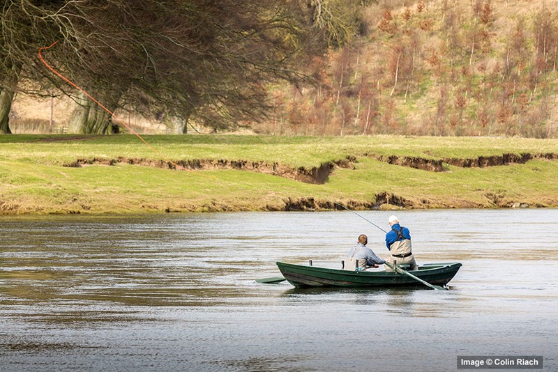 River Tweed salmon fishing from a boat.