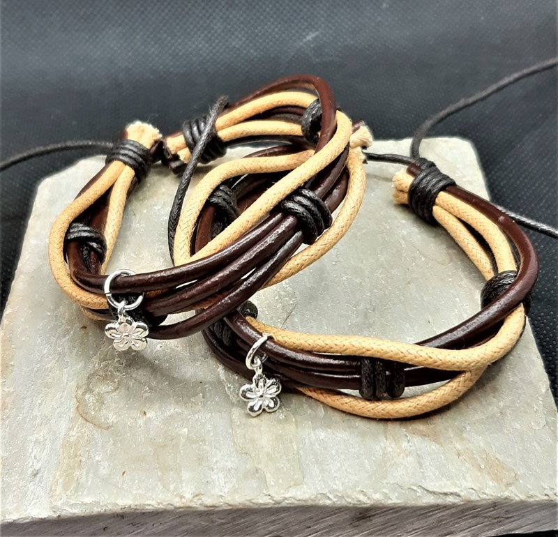 Leather bracelets each with a Sterling Silver flower (925) charm