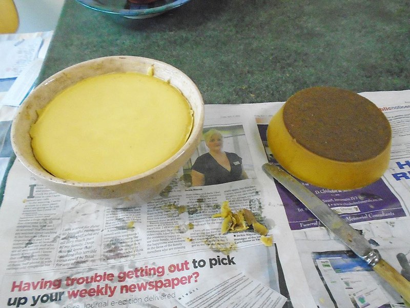 Almost there - consolidation of the thin slabs. The brown crust has to be removed before the wax is ready for Honey Show entry. There will be liquid in the bottom of the basin.