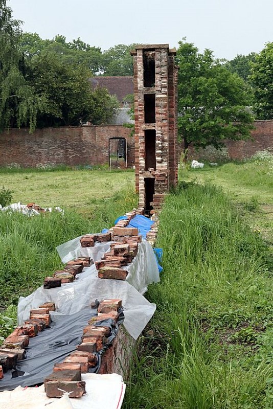 Once the debris is cleared the heated wall system can clearly be seen.