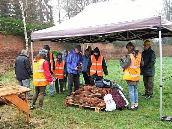 2021 - the volunteer team starts work cleaning bricks