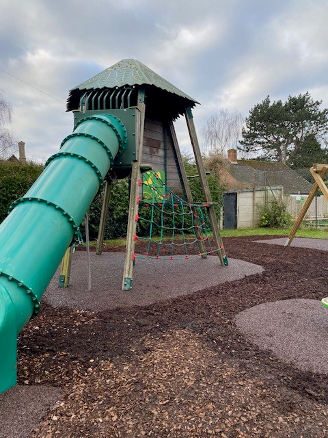 New rubber surfacing under treehouse climbing frame
