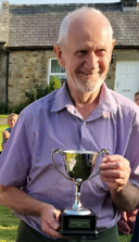 The winner with a trophy at the Kirkwhelpington Show