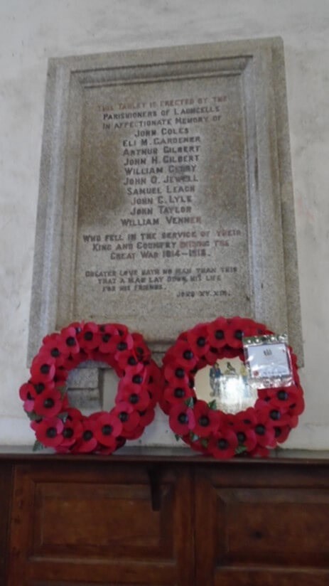 Wreaths under remembrance plaque
