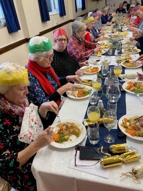 People eating Christmas lunch