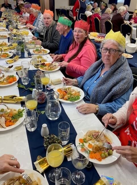 People eating Christmas lunch