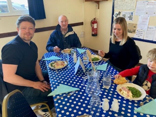 People sitting around a table eating