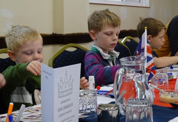 Children with decorated questionnaires