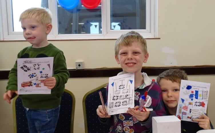 Children with decorated questionnaires