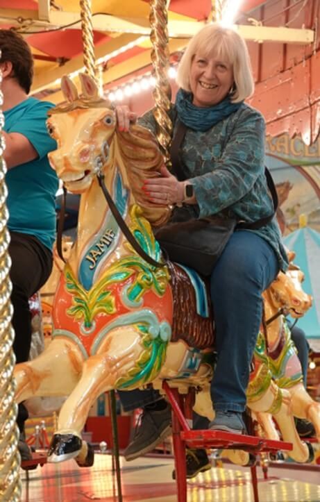 Person on carousel