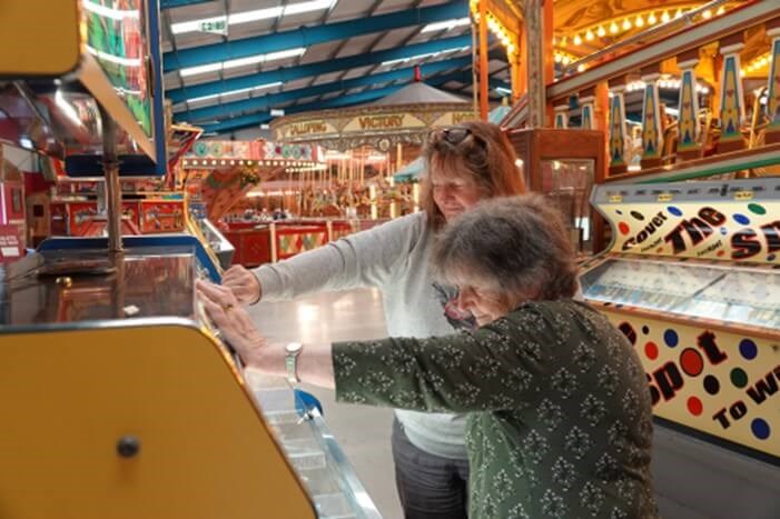 People playing on slot machine