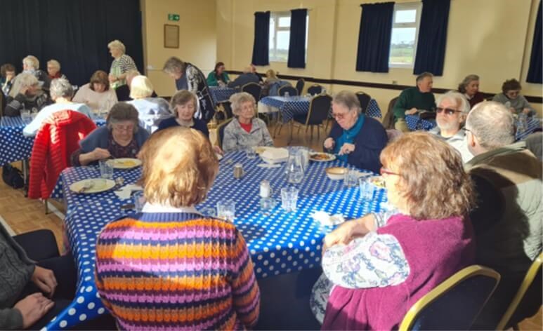 People sitting around tables eating