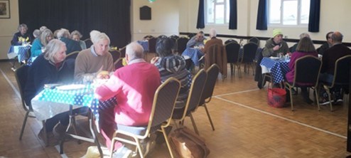 People sitting at tables eating