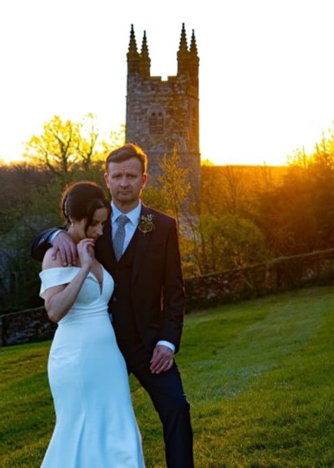 Wedding photo of couple outside church