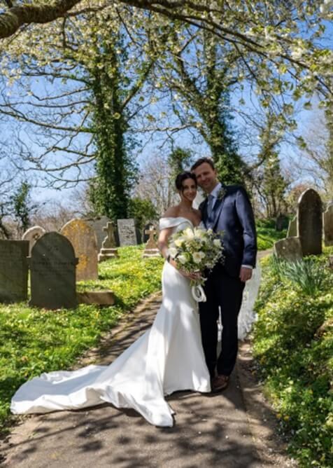 Wedding photo fo couple outside church
