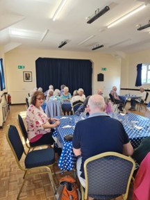 People sitting at tables and eating
