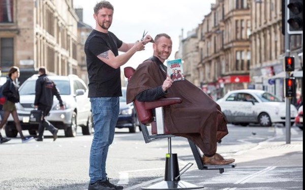 Getting a haircut, in the middle of the road, Byres Road Book Festival, September 2016