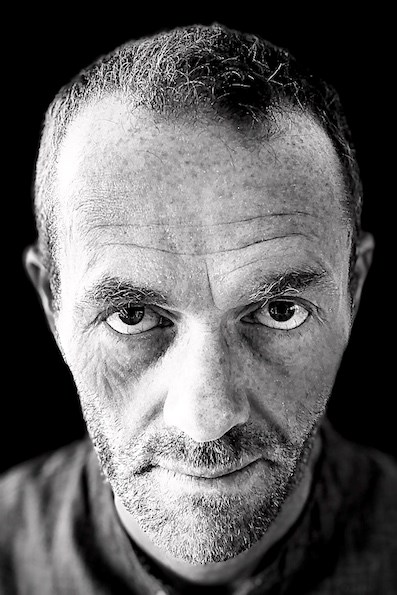 A crime writer in his natural b&w setting