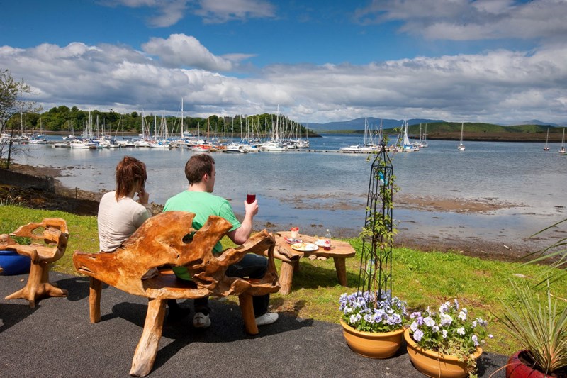 Outside view from Poppies Garden Centre towards Dunstaffnage Castle and Marina