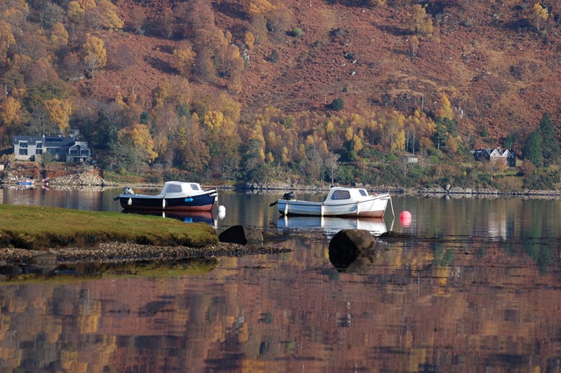 A couple of Taynuilt Boat Club's boats on a flat calm Loch Etive